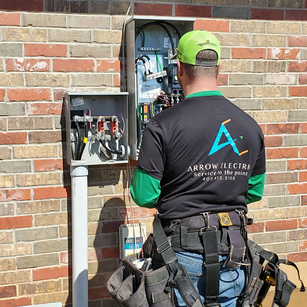 Arrow Electric service man installing generator